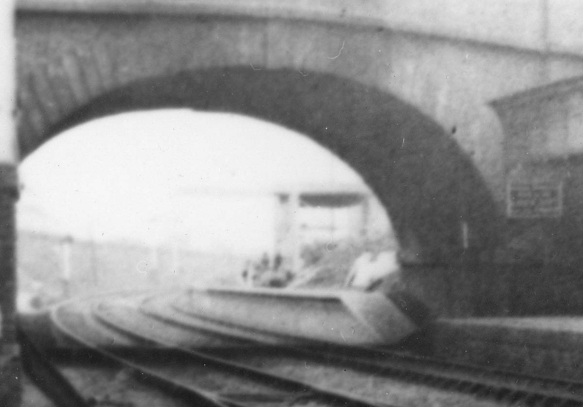Close up showing on the right the new down platform and station building being erected and on the left the original up platform