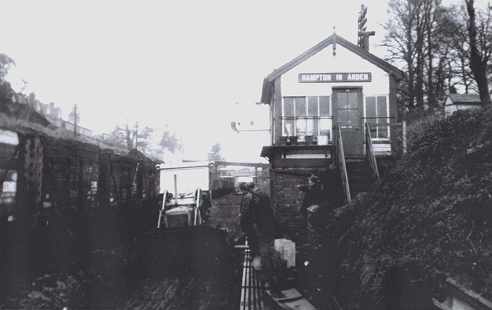 View of a Drott being used to remove stone ballast from the up line adjacent to Hampton in Arden signal box circa 1960s