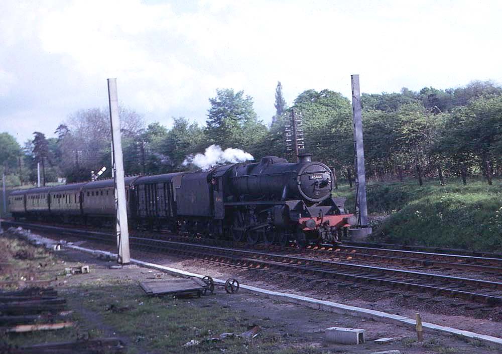 Ex-LMS 4-6-0 5MT No 45442 passes opposite Hampton in Arden's former goods yard with 18:10pm working on 15th June 1965