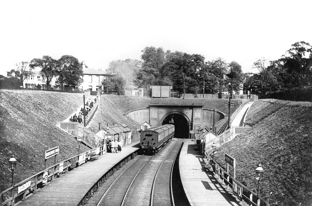 Looking towards Handsworth Junction as a LNWR four-coach local passenger service enters the short tunnel
