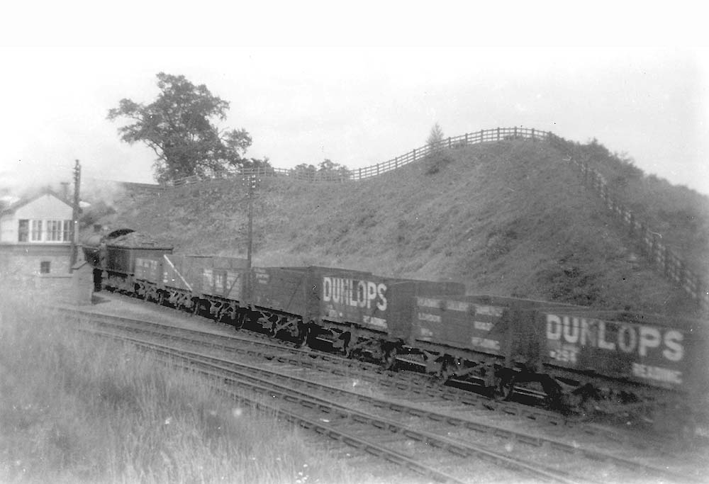 An unidentified ex-LNWR 0-8-0 'Super D' accelerates from Kenilworth Junction whilst at the head of a train of empty mineral wagons