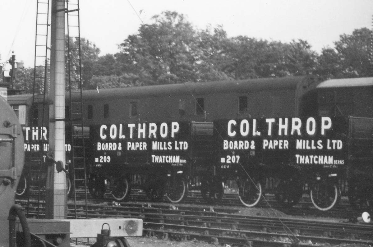 Close up showing a number of Colthrop Board & Paper Mills wagons in transit to their new home in Thatcham in Berkshire
