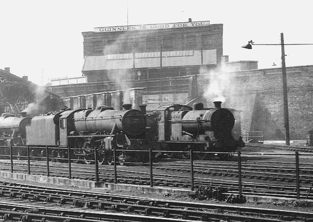 Close up showing a section of the shed with its roof removed and some of the locomotives being serviced