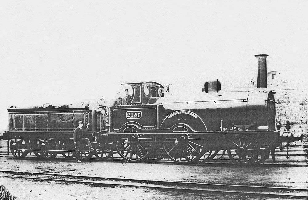 LNWR 2-4-0 Samson Class No 2157 'Unicorn' poses with its crew and other members of staff in front of the shed