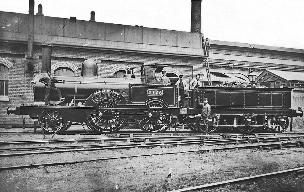 LNWR 2-4-0 Samson Class No 2156 'Sphinx' poses for the camera alongside Monument Lane's Water Tank and shed