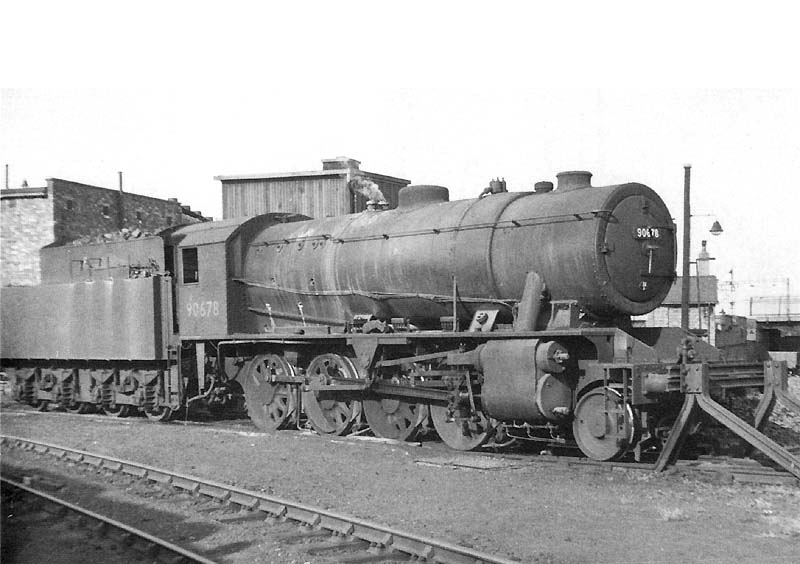 Ex-WD 'Austerity' 8F 2-8-0 No 90678 is seen at the rear of the shed next to the turntable having been coaled and watered 