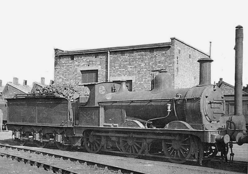 Midland Railway 3F 0-6-0 No 58240 is seen standing on one of the roads next to the stationary boiler on 15th March 1953