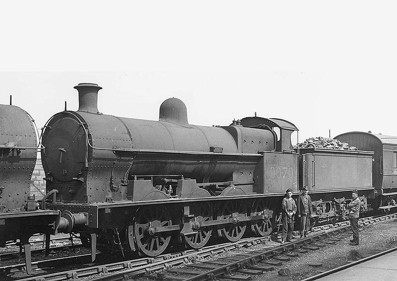 Ex-LNWR 7F 0-8-0 Class G2a No 9070 is seen coupled buffer to buffer with another class member in the up sidings