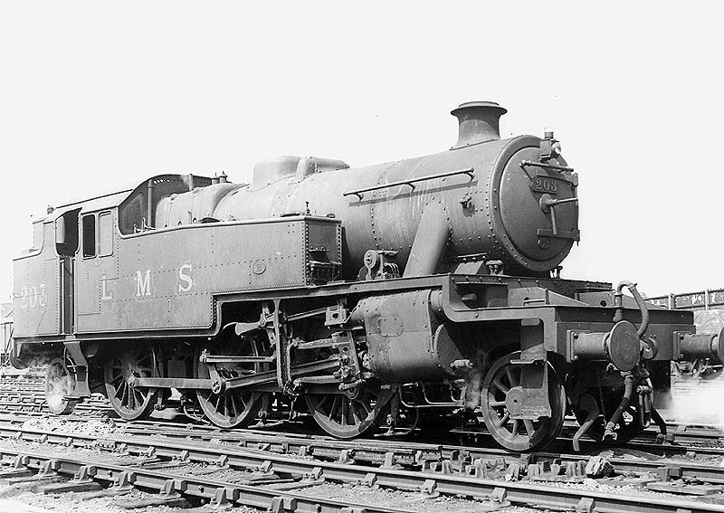 LMS 2-6-2T 3MT No 203 now fitted with the larger boiler is seen standing light engine adjacent to the up marshalling yard
