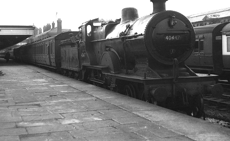 Ex-Midland Railways 2P No 40447, a 483 class locomotive, is seen standing at platform two with a local stopping train