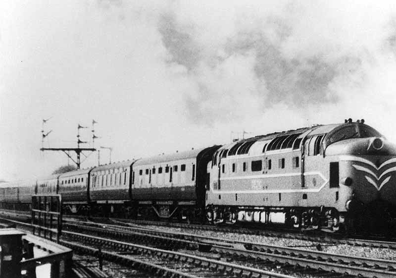 English Electric Company's experimental Co-Co diesel prototype is seen at the head of an up express as it passes the junction for the Ashby branch line