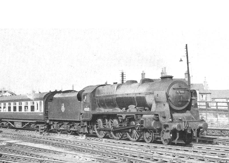 Ex-LMS 4-6-0 rebuilt Patriot class No 45522 'Prestatyn' is seen at the head of an up express service as it passes through Nuneaton station