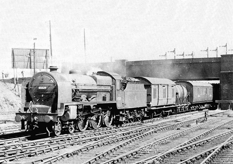 Ex-LMS 4-6-0 Patriot class No 45539 'EC Trench' is seen at the head of a down class C freight made up of XP rolling stock