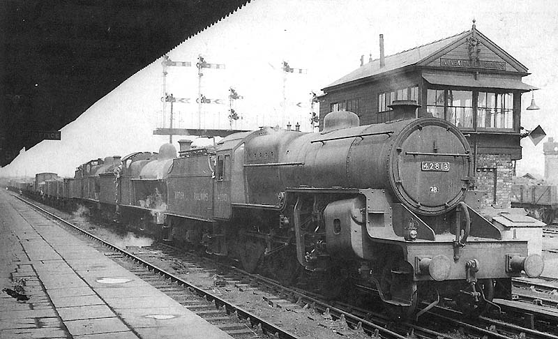 Ex-LMS 2-6-0 'Horwich Crab' No 42813 triple heads an up freight train past Nuneaton Up Sidings Signal Cabin in 1951