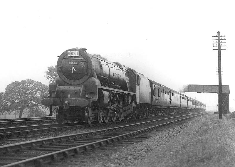 LMS 8P 4-6-2 Coronation class No 6232 'Duchess of Montrose' is seen near Nuneaton station on the down Royal Scot