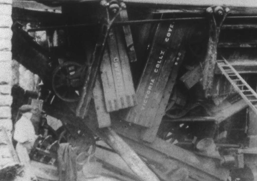 Close up showing the Victoria Colliery Coventry name on the three-plank dumb buffered wagons