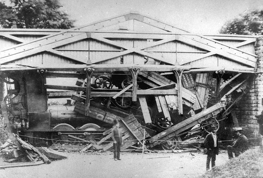 View of the collapsed bridge seen from the other side of the bridge with the tender on the left