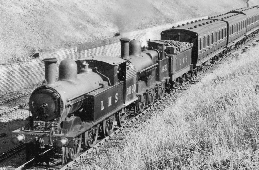 Close up of ex-LNWR 2P 0-6-2T No 6890 and ex-LNWR 2F 0-6-0 No 8430 showing the family likeness shared by all LNWR locomotives