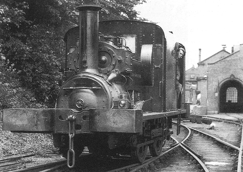 View of Mitchell & Butler's diminutive locomotive 0-4-0ST 'John Barleycorn' seen standing outside its shed on 12th July 1947