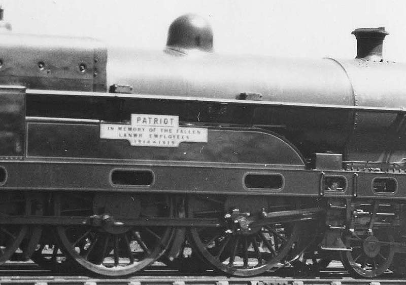 Close up showing No 5964's 'Patriot' nameplate with the sub-text remembering the LNWR employees who died in the 'Great War'