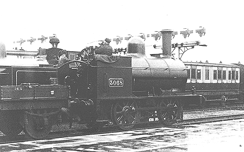 LNWR 0-4-0 four-foot shunter No 3068 passes through the station whilst marshalling coaching stock