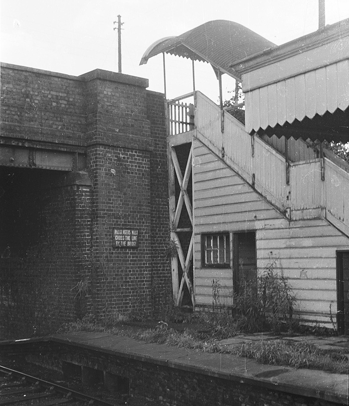 An oblique view of the side elevation of Southam & Long Itchington station's down platform passenger steps to the road bridge