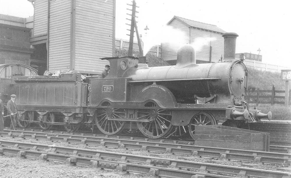LNWR 2-4-0 Improved Precedent class No 790 'Hardwicke' stands at Tamworth with an up stopping service