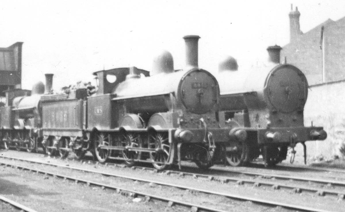 Close up showing ex-LNWR 2F 0-6-0 'Cauliflower' No 8455 standing alongside an unidentified ex-LNWR 7F 0-8-0 'Super D' in the late 1920s
