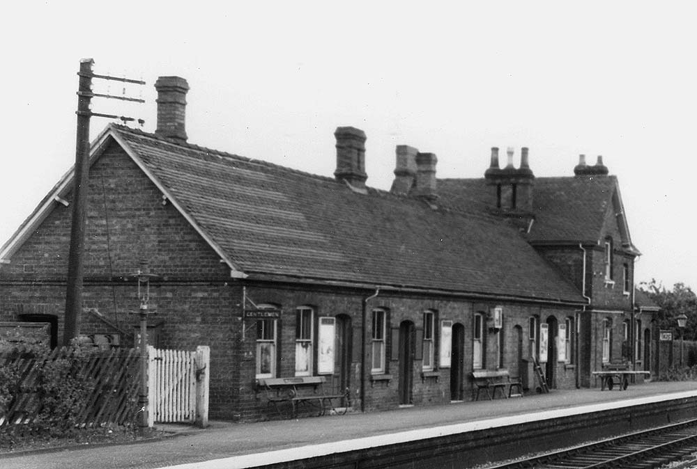 Close up showing the station's main building with doors to the store, waiting room, ladies waiting room, bricked up door to the booking hall and booking office