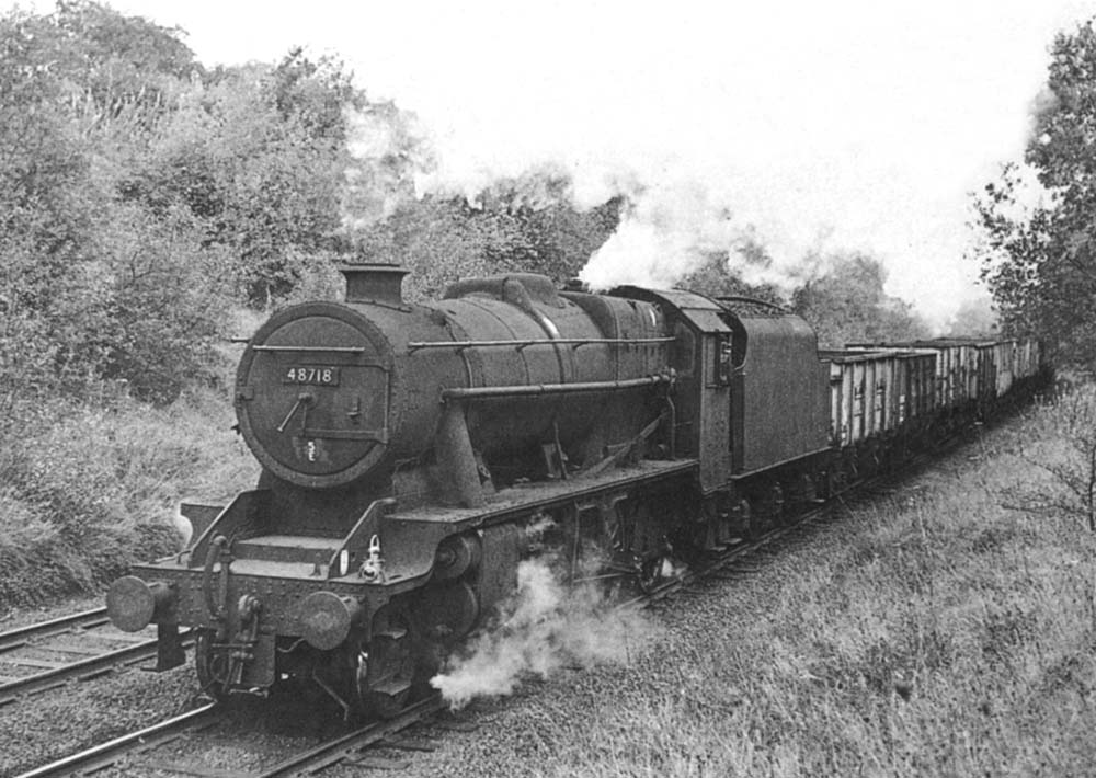 Ex-LMS 8F 2-8-0 No 48718 climbs to the western portal of Arley Tunnel with a train of coal empties on Sunday 10th October 1965