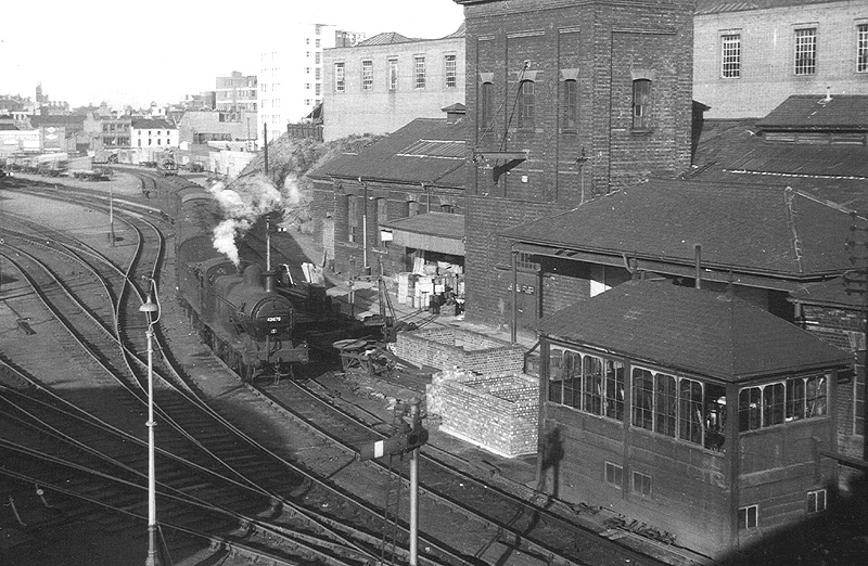 An elevated view of the Midland Railway's Central Goods Depot signal box as ex-MR 0-6-0 3F No 43675 leaves the yard at the head of a freight train