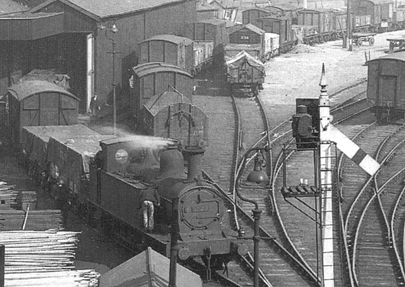 Close up showing an unidentified Midland Railway 1377 class locomotive on duty shunting the metal shed siding