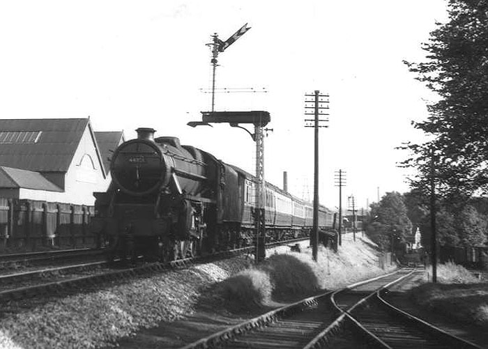An unidentified British Railways 5MT 4-6-0 heads a Birmingham bound train past Cadbury's sidings on Sunday 12th September 1954