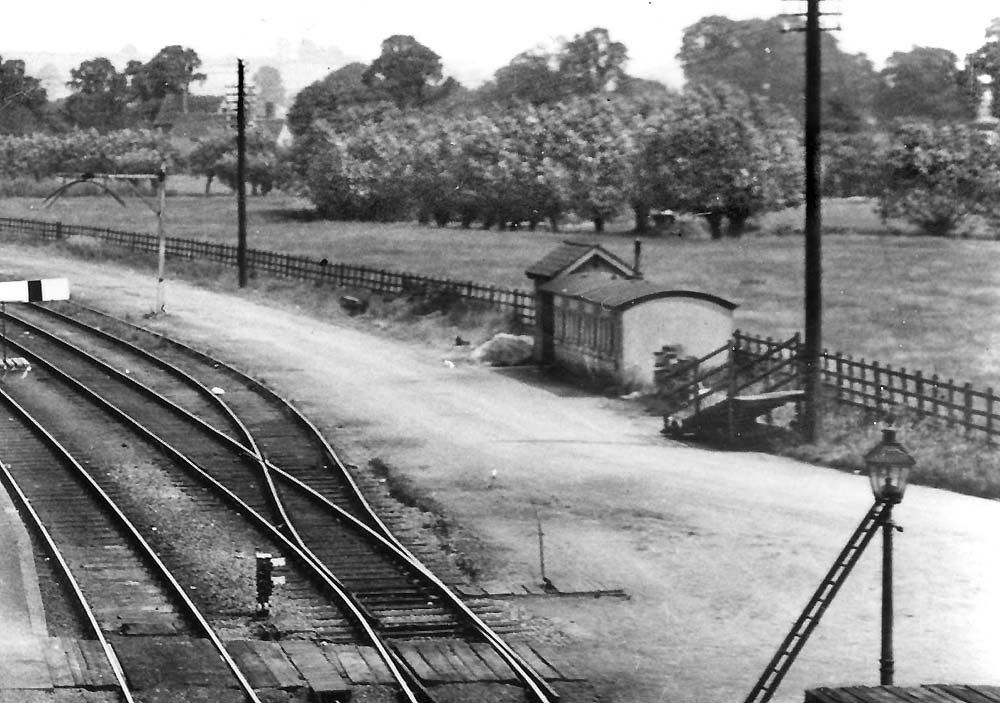 Close up showing the grounded coach body, hut and wheeled ramp in Broom Junction's goods yard