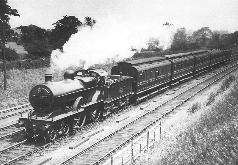 Ex-MR 2P 4-4-0 No 426 is seen on the new down fast line whilst at the head of a down service to Gloucester