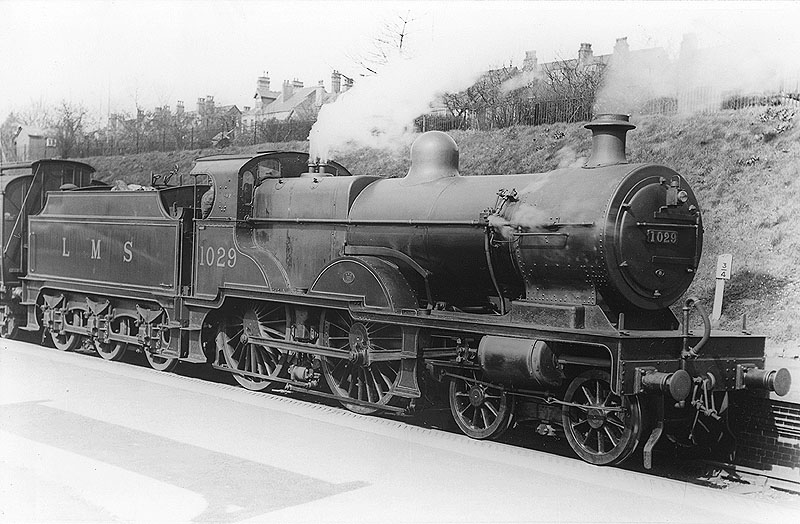 LMS 4-4-0 'Compound' No 1029 is seen with safety valves lifting whilst standing at the head of an up local passenger service to New Street via the West Suburban route
