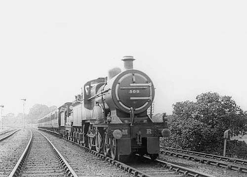 MR 4-4-0 No 509 doubleheads MR 4-4-0 No 126 on an up express train south of Kings Norton