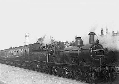 MR 4-4-0 1P No 323 is seen standing in Kings Norton at the head of a local passenger train on 21st August 1912