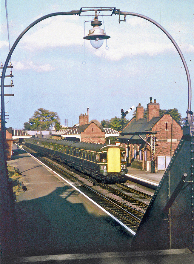 A British Railways Diesel Multiple Unit  Inter-City set passes through Kings Norton on the down fast line circa 1964