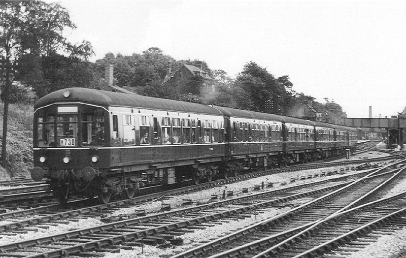 Three sets of two-car Diesel Multiple Units form this holiday excursion from Birmingham New Street to Malvern on 8th July 1956