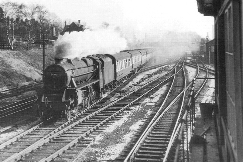 Ex-LMS 4-6-0 'Class 5' No 44945 is seen travelling at speed on a Derby to Bristol express passenger train on 7th March 1954