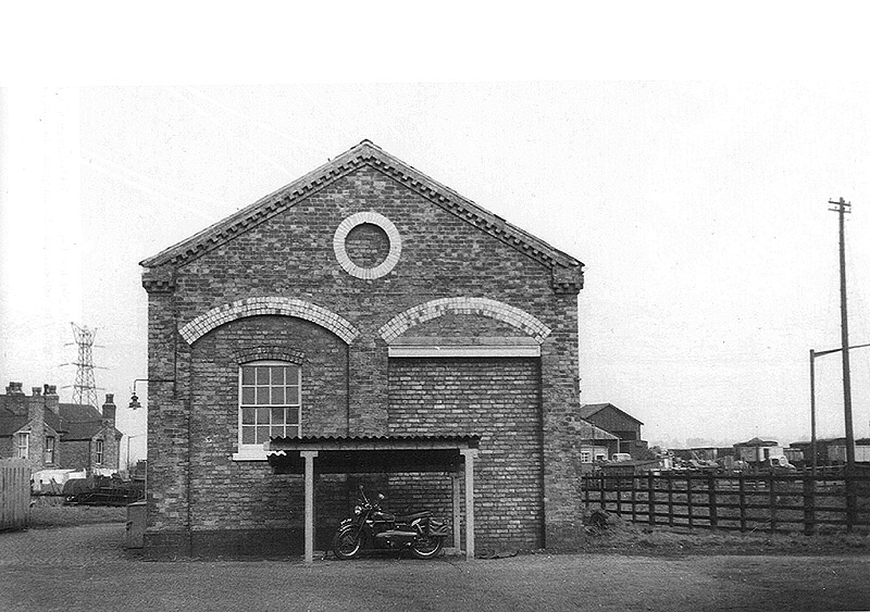 End view of Lifford Station Junction goods shed showing the bricked-up rail entrance and cycle shed