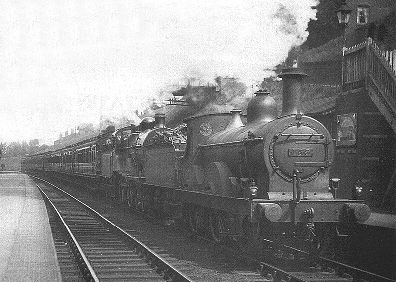 MR 2-4-0 1P No 155 is seen piloting an unidentified MR 4-4-0 locomotive on an express working to Bristol
