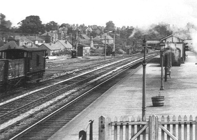Close up showing part of a goods train and guards van stabled in one of Northfield station's three sidings