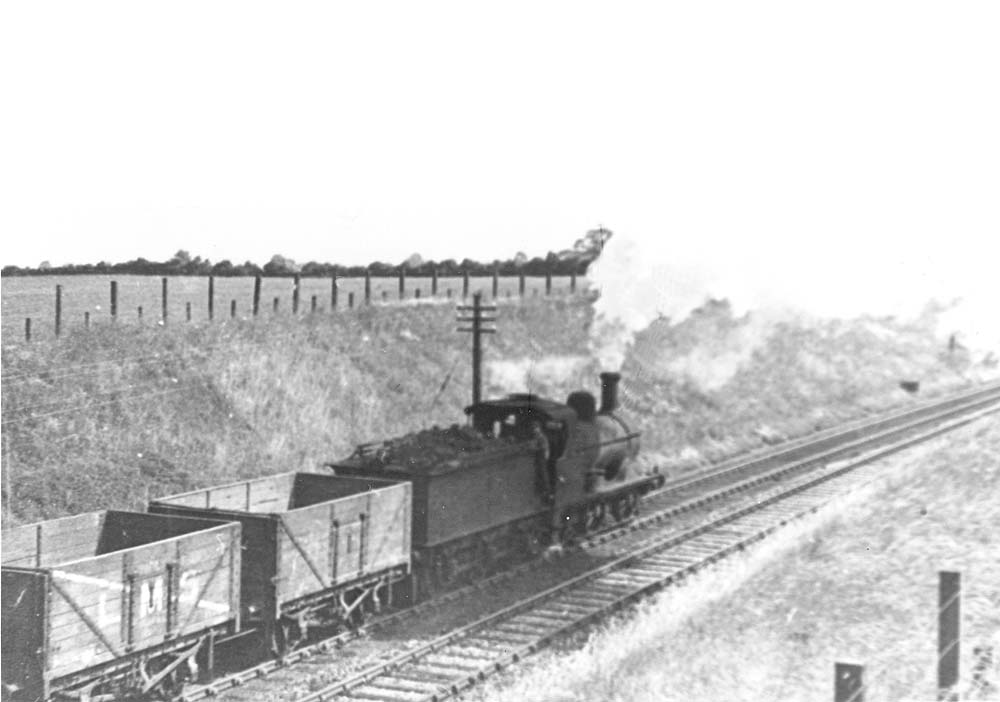 Ex-MR 2F 0-6-0 No 2996 is seen approaching Nuneaton on an empty mineral working on 4th April 1941