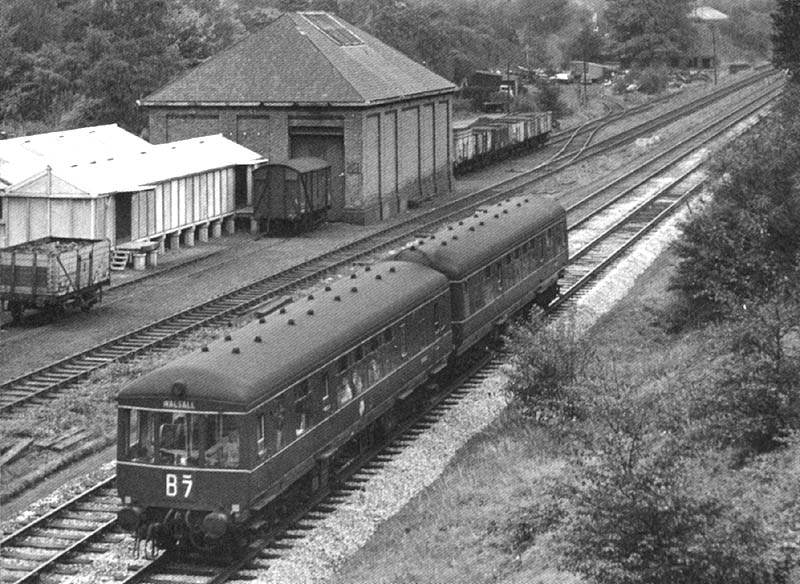 A two-car Gloucester RCW Diesel Multiple Unit passes Penns goods yard on 2nd October 1959