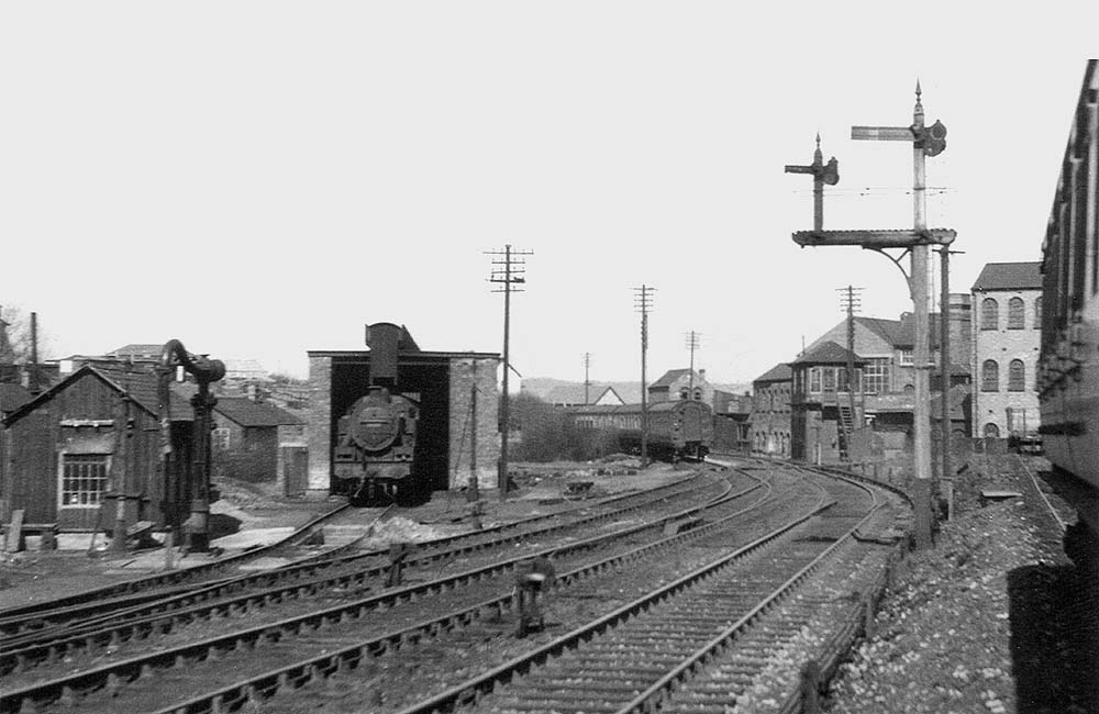 View of Redditch's single road shed, the ash pit in front and the adjacent water crane on Sunday 22nd April 1951