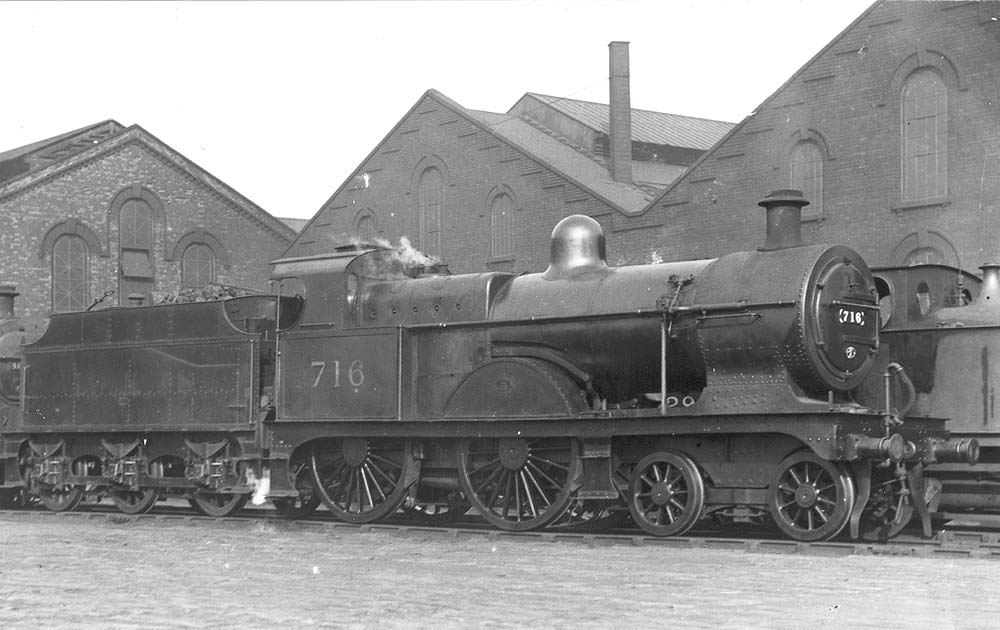 Ex-Midland Railway 3P 4-4-0 No 716 gently simmers alongside one of Saltley shed's roundhouses in September 1936