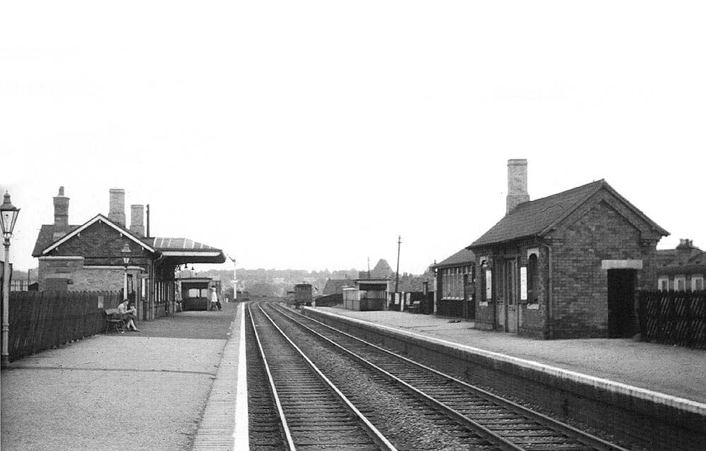 A black and white version of Selly Oak station looking towards Birmingham New Street station