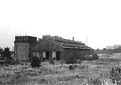 An external view of the Stockingford's abandoned shed with doors rotten and open and all lines removed